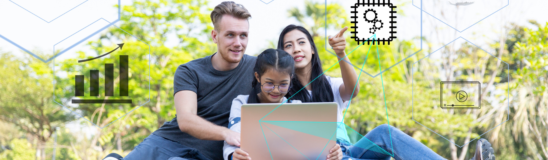 Informed banner Family of three sitting in a park with a laptop.