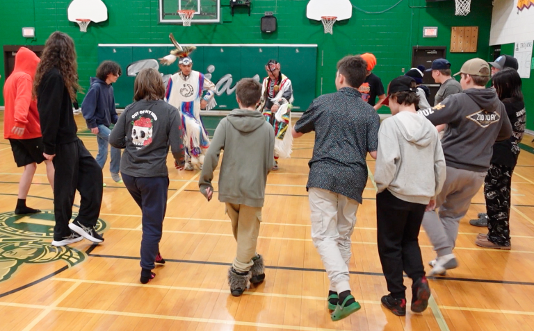 students learning to powwow dance